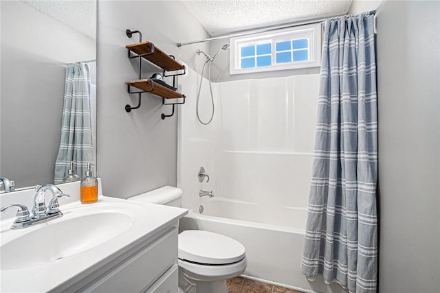 bathroom featuring toilet, shower / tub combo with curtain, tile patterned floors, a textured ceiling, and vanity