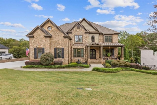 craftsman-style home with a front yard and a porch