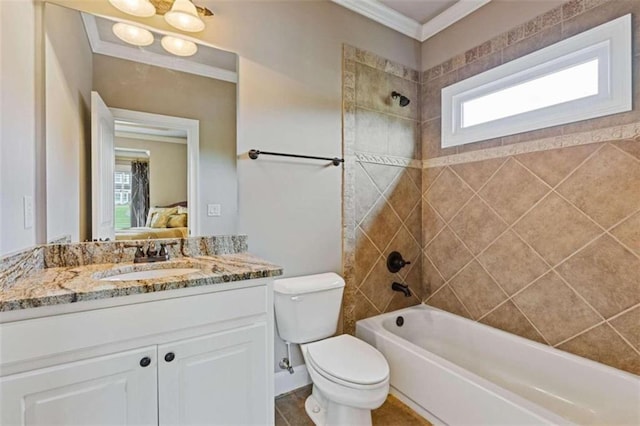 full bathroom with tiled shower / bath, vanity, plenty of natural light, and toilet