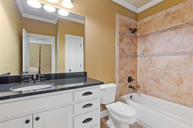 full bathroom featuring crown molding, vanity, toilet, and tiled shower / bath