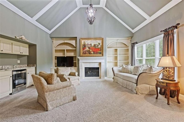 carpeted living room featuring wine cooler, beam ceiling, and high vaulted ceiling