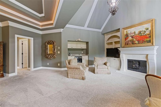 living room with high vaulted ceiling, light colored carpet, an inviting chandelier, and crown molding