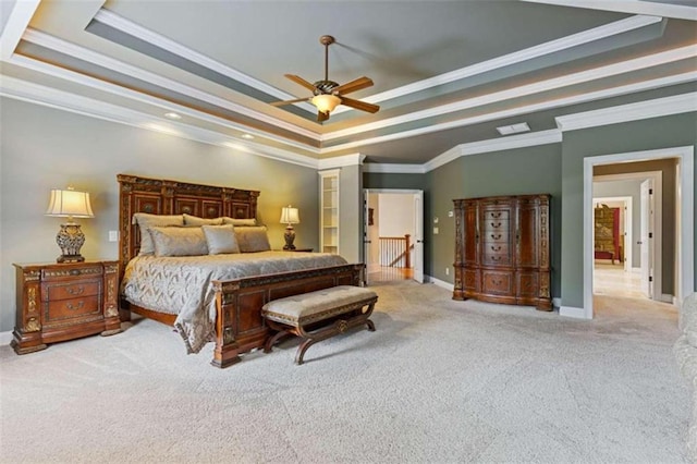 bedroom featuring a tray ceiling, ceiling fan, and crown molding