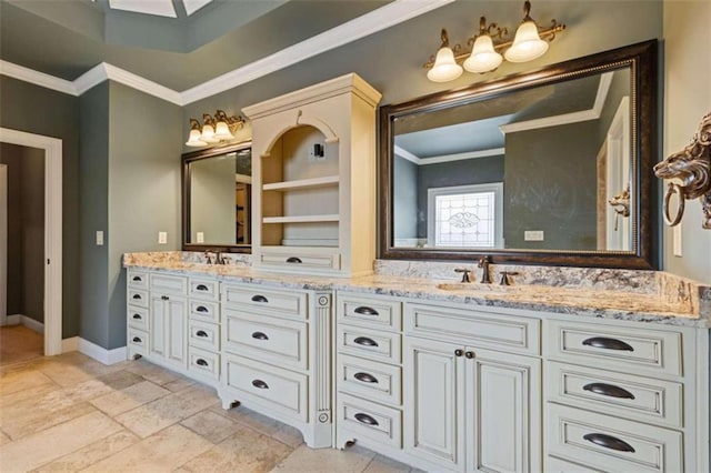 bathroom featuring ornamental molding, vanity, and a skylight