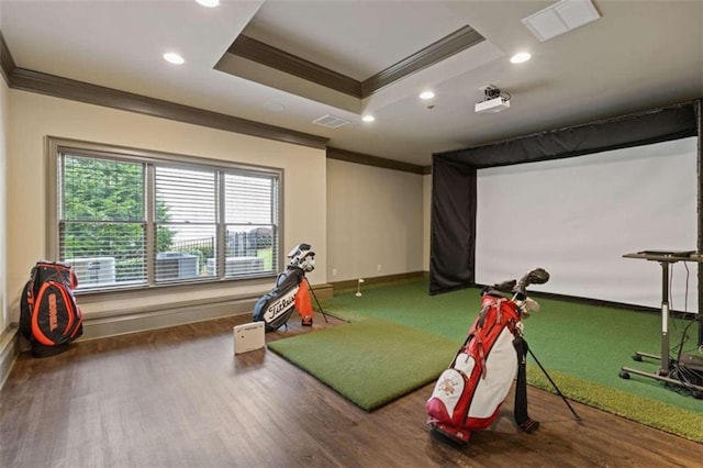 game room with ornamental molding, hardwood / wood-style flooring, and golf simulator