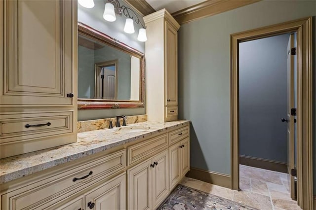 bathroom with ornamental molding and vanity