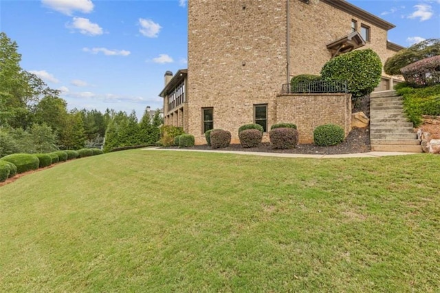 view of home's exterior featuring a yard