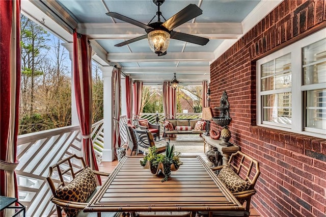 306 Calumet Ln, Monroe, GA 30655 - sunroom / solarium featuring brick wall, crown molding, and beamed ceiling