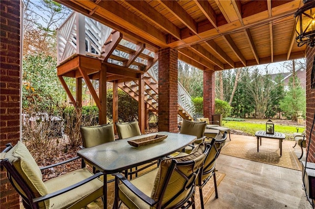 306 Calumet Ln, Monroe, GA 30655 - view of patio / terrace featuring outdoor dining space and stairs