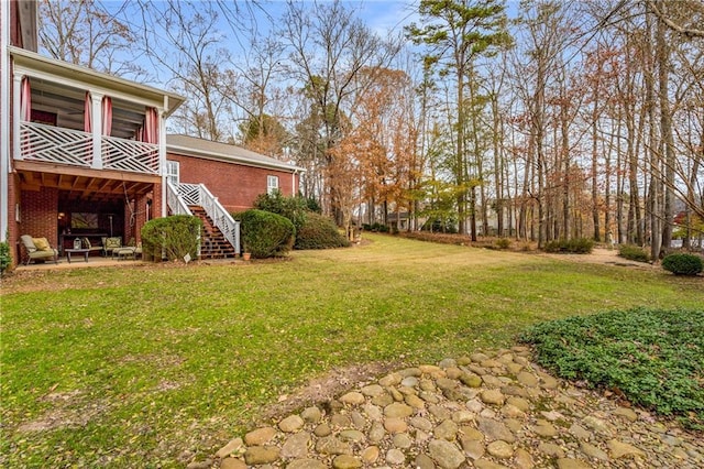 306 Calumet Ln, Monroe, GA 30655 - view of green lawn featuring stairway and a patio