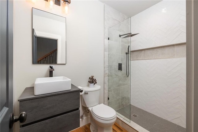 1354 Mcpherson Ave SE, Atlanta, GA 30316 - bathroom with tiled shower, toilet, vanity, and wood finished floors