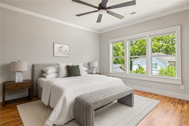1354 Mcpherson Ave SE, Atlanta, GA 30316 - bedroom with crown molding, light wood-style flooring, baseboards, and ceiling fan