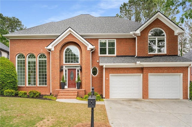 view of front of property featuring a garage, brick siding, a front lawn, and driveway