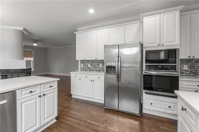 kitchen with decorative backsplash, a ceiling fan, light countertops, ornamental molding, and appliances with stainless steel finishes