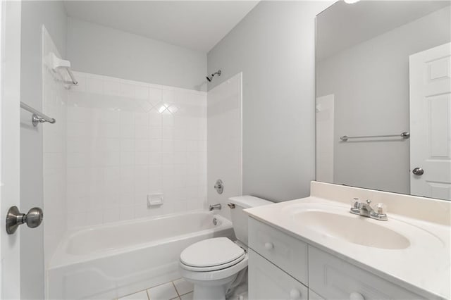 bathroom featuring toilet, vanity, tile patterned flooring, and shower / bath combination