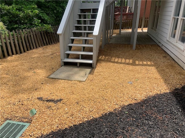 exterior space featuring stairs and fence