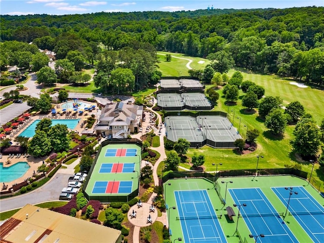 birds eye view of property featuring a forest view