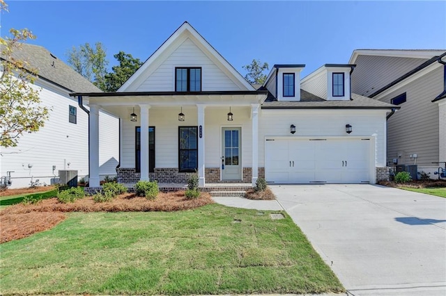 modern farmhouse style home featuring a front lawn, covered porch, and central air condition unit