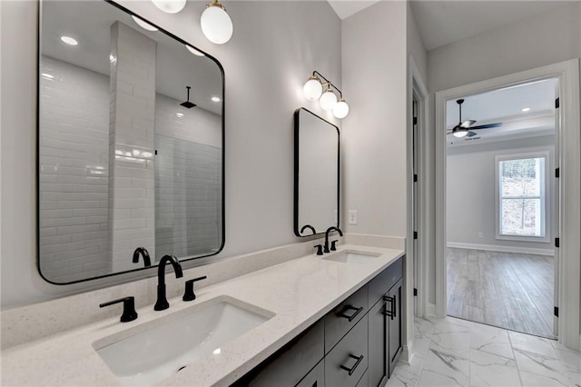 bathroom with walk in shower, wood-type flooring, vanity, and ceiling fan