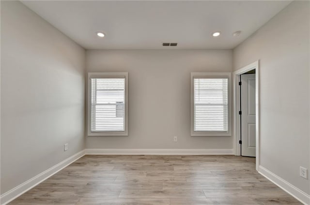 empty room with light wood-type flooring