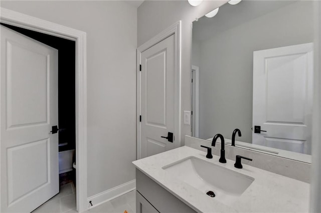 bathroom featuring tile patterned flooring and vanity