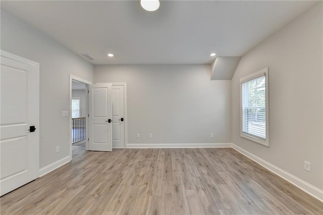 unfurnished room featuring light hardwood / wood-style floors