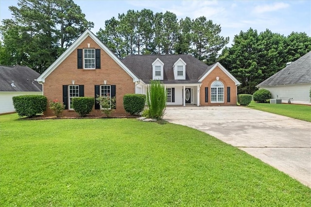 93 Pebble Creek Dr, Newnan, GA 30265 - view of front of home featuring driveway, brick siding, and a front yard