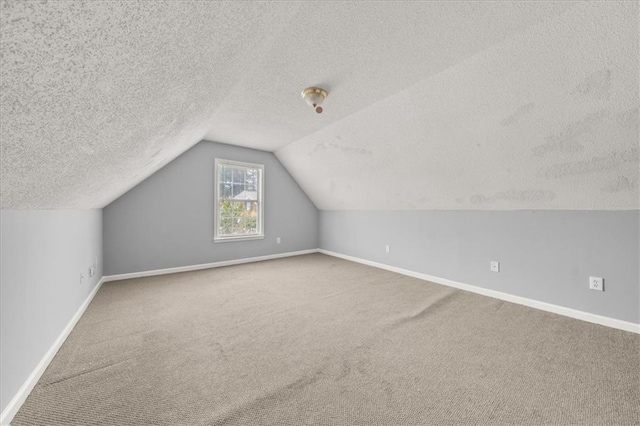 93 Pebble Creek Dr, Newnan, GA 30265 - additional living space featuring carpet, a textured ceiling, and lofted ceiling