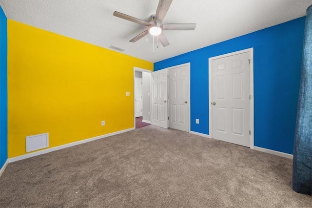 93 Pebble Creek Dr, Newnan, GA 30265 - unfurnished bedroom featuring carpet, a textured ceiling, and ceiling fan