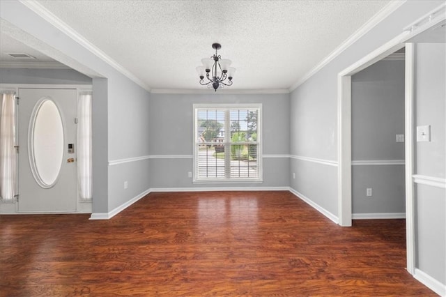 93 Pebble Creek Dr, Newnan, GA 30265 - foyer entrance featuring wood finished floors, a chandelier, a textured ceiling, and ornamental molding