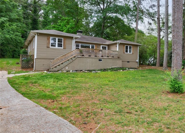 view of front of property with a front yard, a deck, a chimney, crawl space, and stairway
