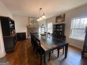 dining room featuring dark hardwood / wood-style flooring and plenty of natural light