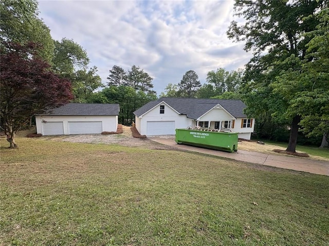 view of yard featuring an outbuilding and a garage