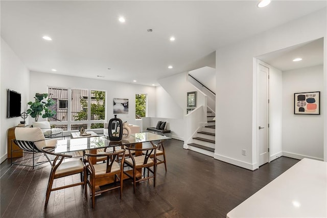 dining space with dark hardwood / wood-style floors