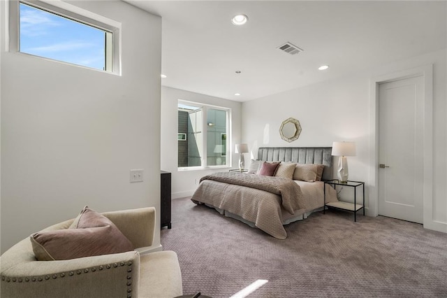 bedroom with light colored carpet