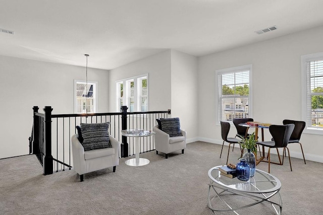 living area with light colored carpet