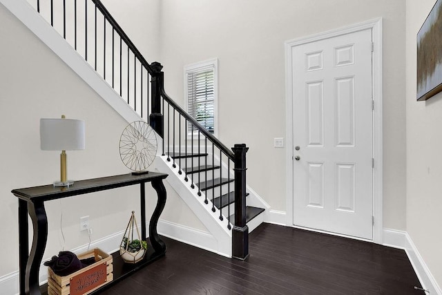 foyer entrance featuring dark hardwood / wood-style floors