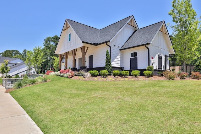 view of side of home featuring a lawn