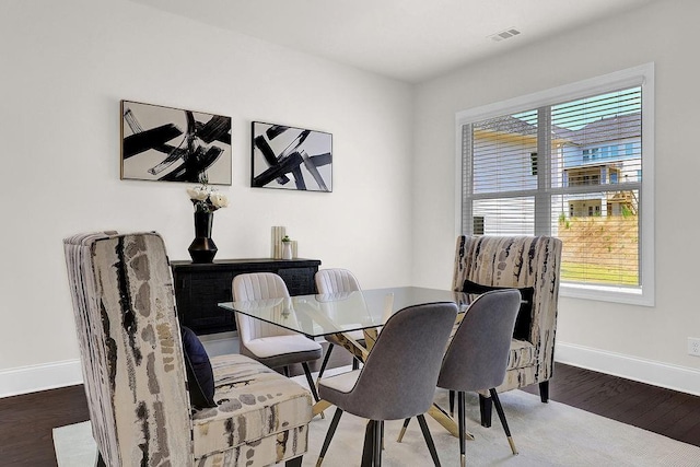 dining space featuring hardwood / wood-style flooring