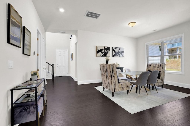 dining area featuring dark hardwood / wood-style floors