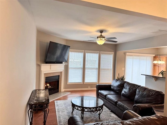 living room with ceiling fan and wood-type flooring