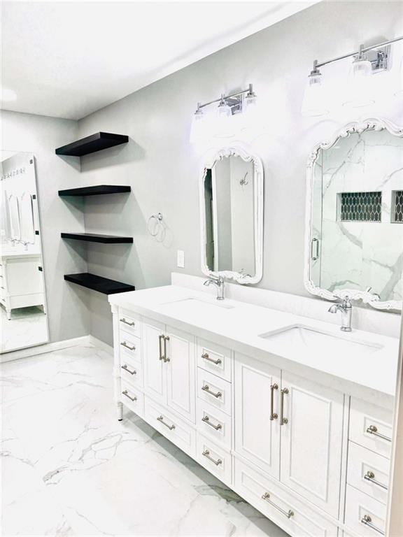 bathroom with walk in shower and vanity