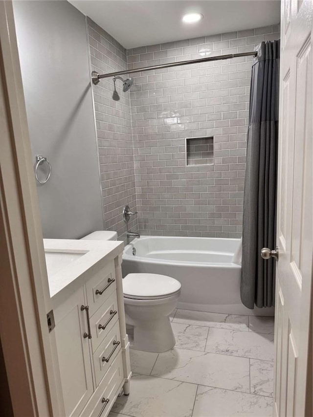 full bathroom featuring toilet, vanity, and shower / tub combo with curtain