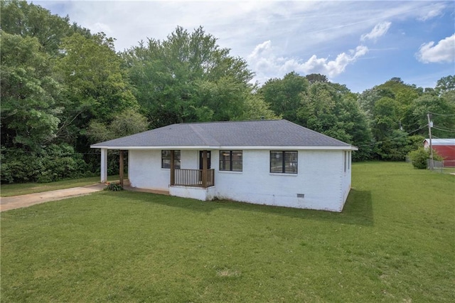 ranch-style house featuring crawl space, covered porch, a front yard, and concrete driveway