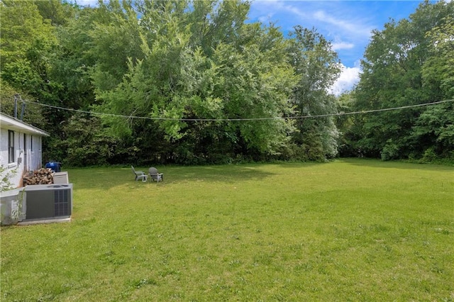 view of yard with central AC unit
