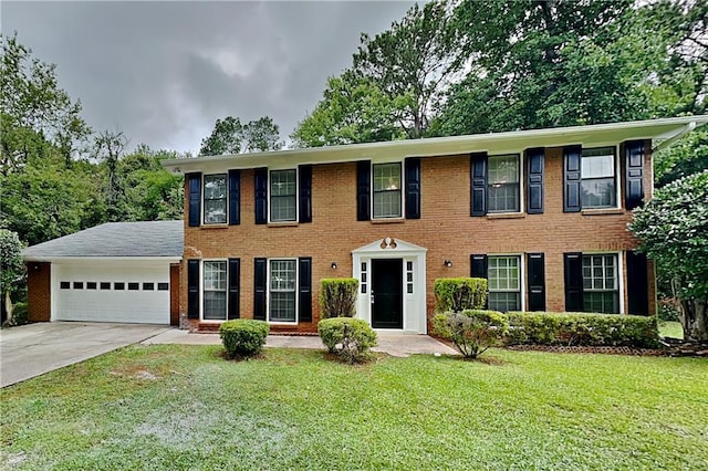650 Lake Forest Ct, Roswell, GA 30076 - colonial-style house with a garage, driveway, a front yard, and brick siding