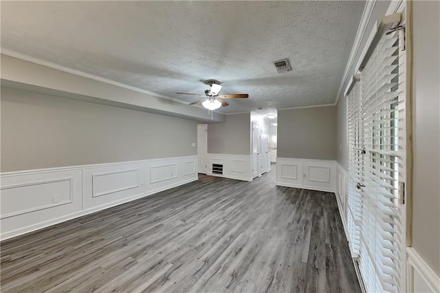 650 Lake Forest Ct, Roswell, GA 30076 - unfurnished room featuring a ceiling fan, a decorative wall, crown molding, wood finished floors, and a wainscoted wall