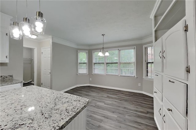 650 Lake Forest Ct, Roswell, GA 30076 - kitchen with a chandelier, crown molding, white cabinets, dark wood finished floors, and light stone counters