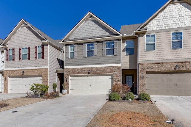 view of front facade with a garage and concrete driveway