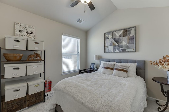 bedroom with vaulted ceiling, ceiling fan, visible vents, and baseboards